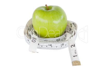 Green apple circled with a tape measure