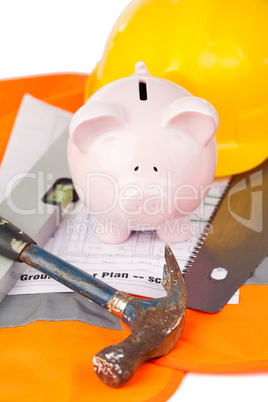 Tools and miniature house on an orange jacket