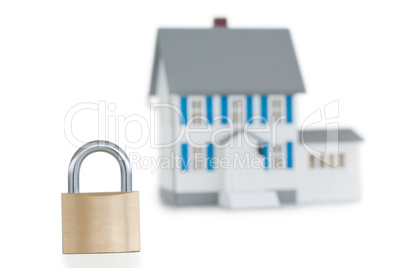 House locked with padlock against a white background