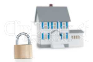 House locked with padlock against a white background