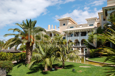 The building of luxury hotel and palm trees, Tenerife island, Sp