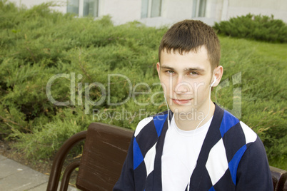 Closeup of a young male student in the headphones