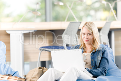 Young happy high-school student relax with laptop