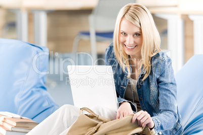 Young happy high-school student relax with laptop