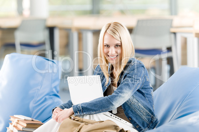 Young happy high-school student relax with laptop