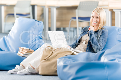 Happy student girl relaxing at high school