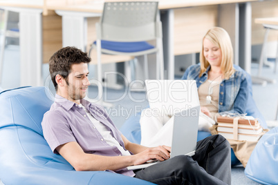 Young students at high-school working on laptop