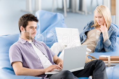 Young students at high-school working on laptop