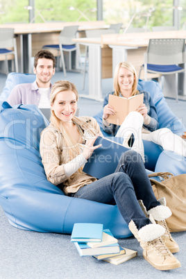 Group of high-school students with books sitting