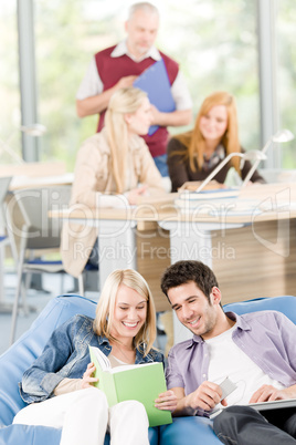 High-school students with mature professor listen music