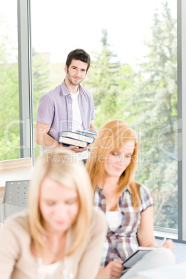 Group of young high school students learning