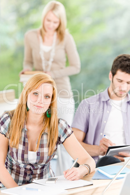 Group of young high school students learning