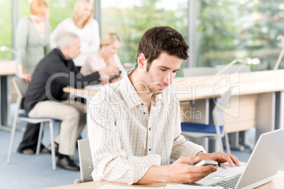 Young business students - businessman in front