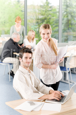 Business office student team working on laptop