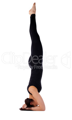 Yong woman exercise yoga supported headstand