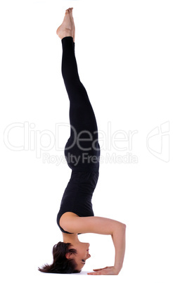 woman doing yoga exercise - head stand