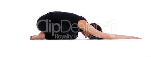 young woman doing yoga pose - child asana isolated