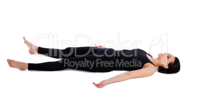 young woman relax after yoga - savasana pose