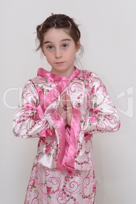 Cute smiling girl in Japanese masquerade costume