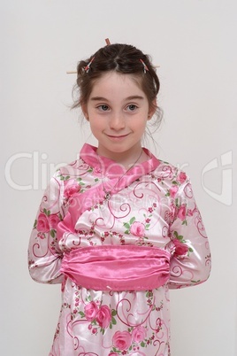 Cute smiling girl in Japanese masquerade costume