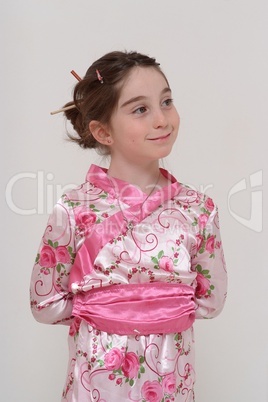 Cute smiling girl in Japanese masquerade costume