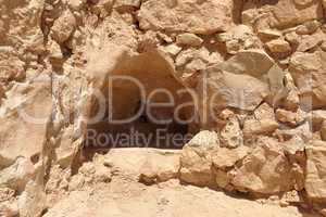 Tiangular niche in wall of ancient ruined Masada fortress in Israel