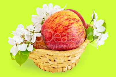 Red apples in a basket with flowers