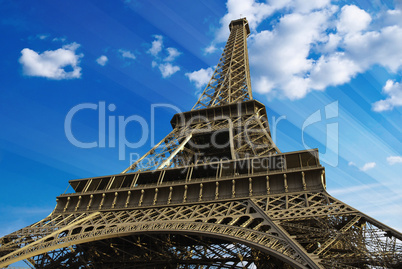 Eiffel Tower at Sunset against a Cloudy Sky