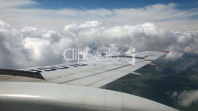 Airplane wing, sky and clouds