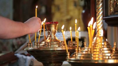 hand with candle in  church