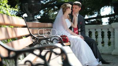 bride and groom on the bench