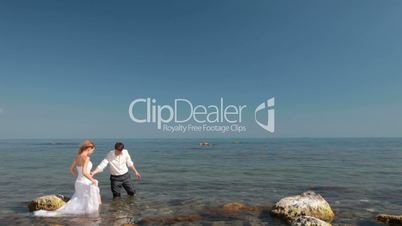 happy bride and groom by the sea