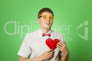 Smiling guy holding heart shape