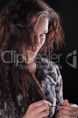 Curly brunette woman look at camera