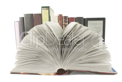 Open book with a row of books and ebook behind it on white background