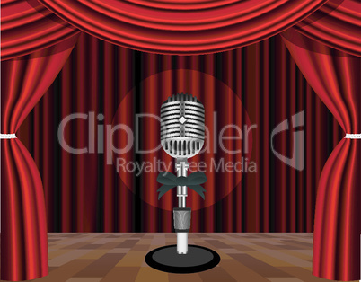 A microphone on a stage with a spotlight on it.