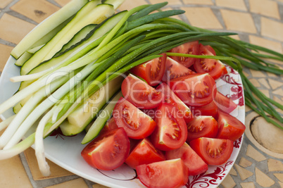 Raw tomatoes, onion and cucumber