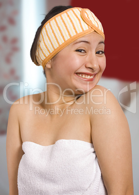 Woman wrapped in a bath towel