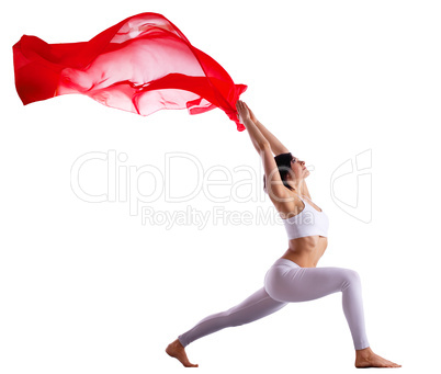 woman in yoga pose with red flying fabric