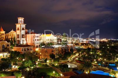 Night illumination of luxury hotel during sunset and Playa de la
