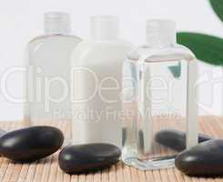 Black stones and massage oil