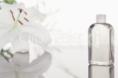 White orchid a glass phial with a camera focus on the object