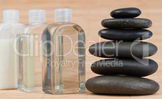 Close up of glass flasks and a black stones stack