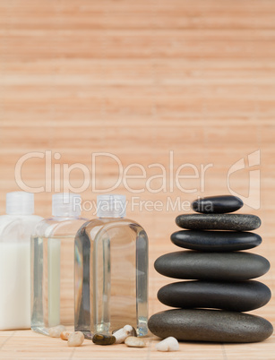 Glass flasks with pebbles and a black stones stack