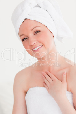 Gorgeous young woman wrapped in a towel