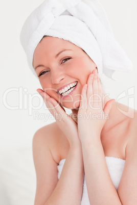 Charming young woman wrapped in a towel