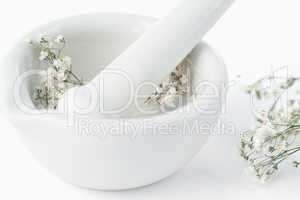 Mortar and pestle with flowers