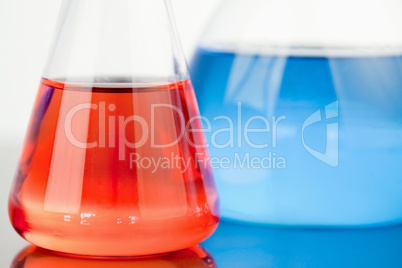 Blue and red beakers