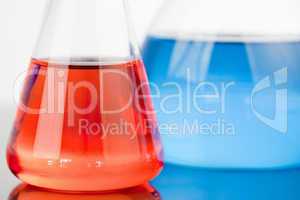 Blue and red beakers