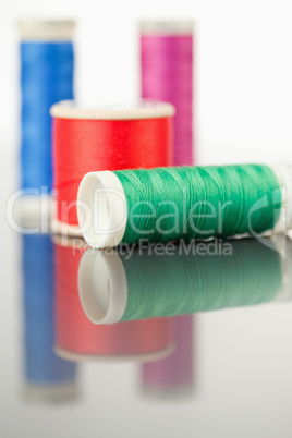 Colorful spools of thread on a table
